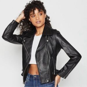 BCBG Moto Jacket.Gently Used.Missing a small grommet.Zippers pockets look great